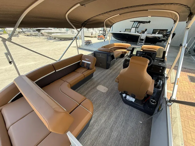 Slide: The Image of 2026 Bennington 24 MSB pontoon boat interior with brown seating and canopy. - 5
