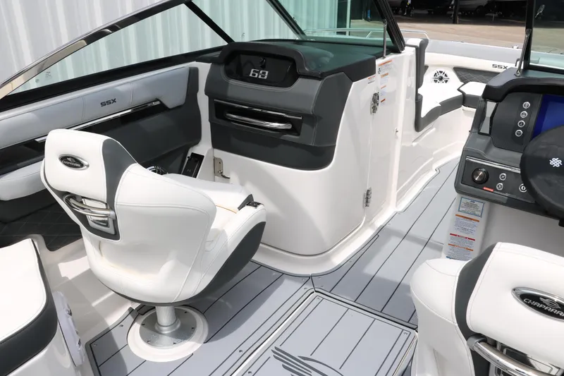 Slide: The Image of 2025 Chaparral 267 SSX boat interior with modern seating and dashboard design. - 17