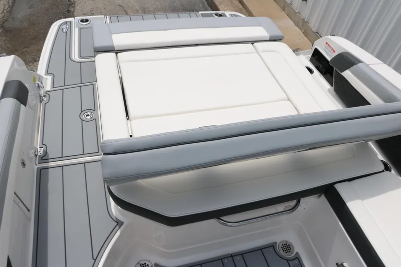 Slide: The Image of 2025 Chaparral 267 SSX boat with sleek gray and white seating and deck design. - 18