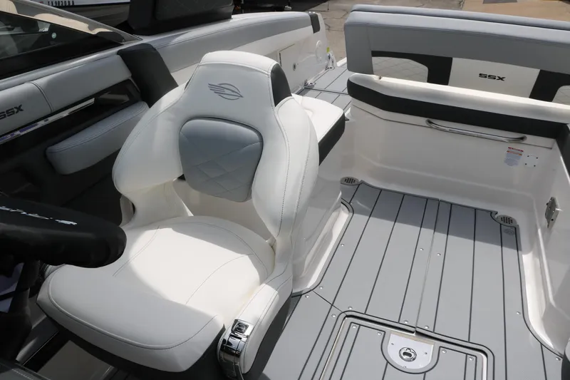 Slide: The Image of 2025 Chaparral 267 SSX boat interior with white seating and sleek design. - 29