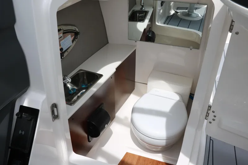 Slide: The Image of 2025 Chaparral 267 SSX boat interior with sink and toilet. - 30