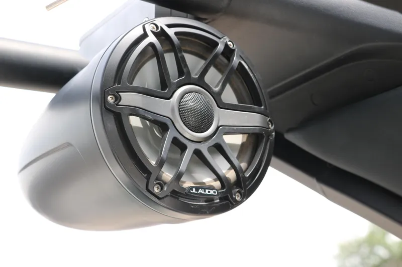 Slide: The Image of JL Audio speaker on 2025 Chaparral 267 SSX boat, mounted under a canopy. - 32