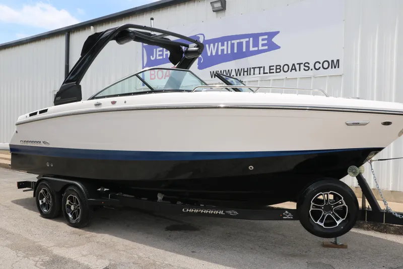 Slide: The Image of 2025 Chaparral 267 SSX boat on trailer outside dealership. - 4