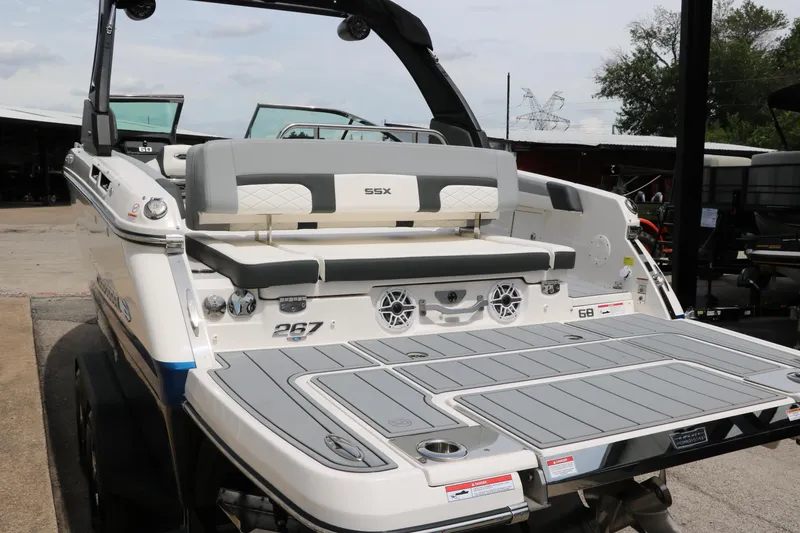 Slide: The Image of 2025 Chaparral 267 SSX boat with spacious rear deck and seating. - 9