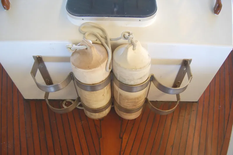 Slide: The Image of Fenders on Island Gypsy 36 Quad Cabin, 1983, secured on wooden deck. - 43