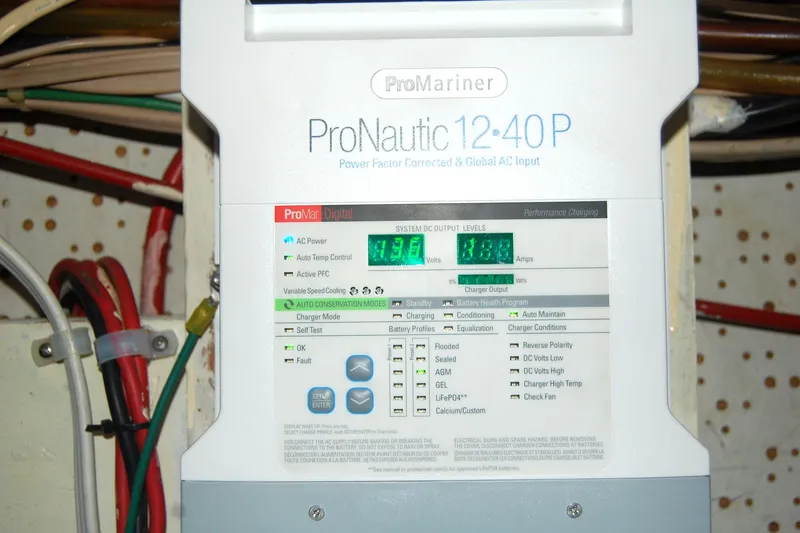 Slide: The Image of ProNautic 12-40P marine battery charger display with voltage and amperage readings. - 48