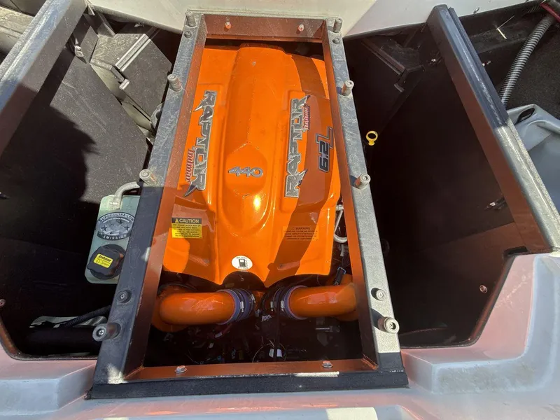 Slide: The Image of 2016 Tigé Z3 boat engine, featuring a vibrant orange Raptor 400 motor. - 10