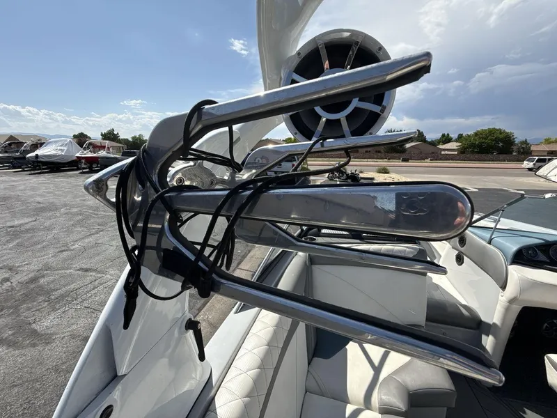 Slide: The Image of 2016 Tigé Z3 boat with wakeboard rack and speaker, parked outdoors. - 12
