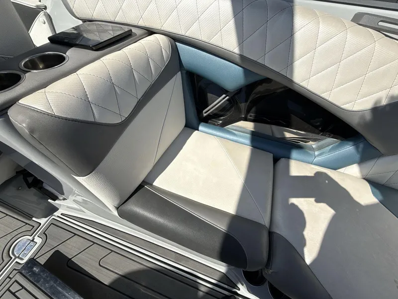 Slide: The Image of 2016 Tigé Z3 boat interior with quilted seating and cup holders. - 14