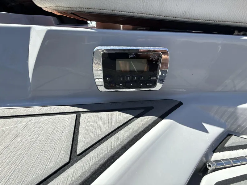 Slide: The Image of 2016 Tigé Z3 boat dashboard featuring a Polk audio system. - 15