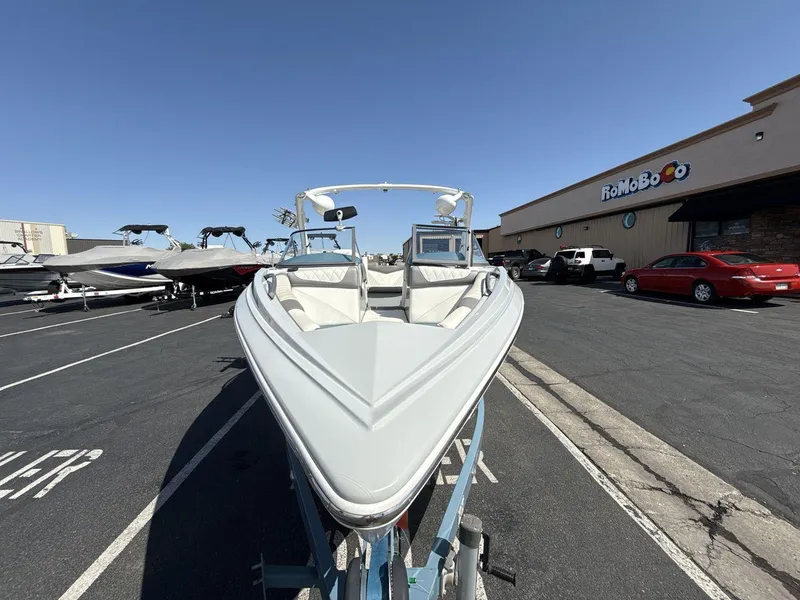 Slide: The Image of 2016 Tigé Z3 boat on trailer in parking lot, clear sky background. - 8