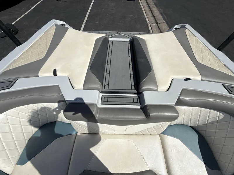 Slide: The Image of 2016 Tigé Z3 boat interior with beige and gray seating, quilted design. - 9