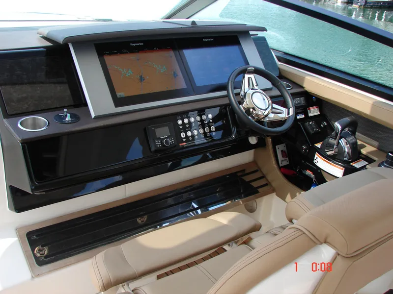 Slide: The Image of Helm of 2018 Sea Ray SLX 400 with advanced navigation system and luxurious seating. - 11