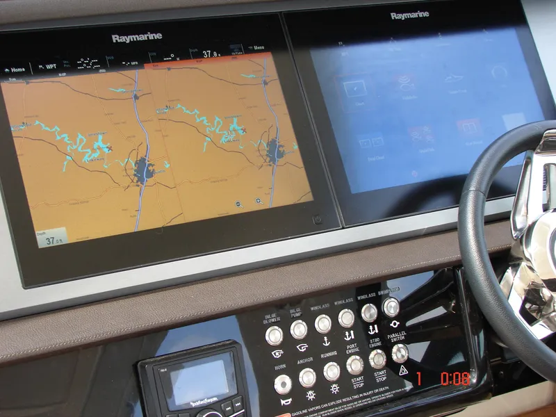 Slide: The Image of Helm of 2018 Sea Ray SLX 400 with Raymarine navigation displays. - 13