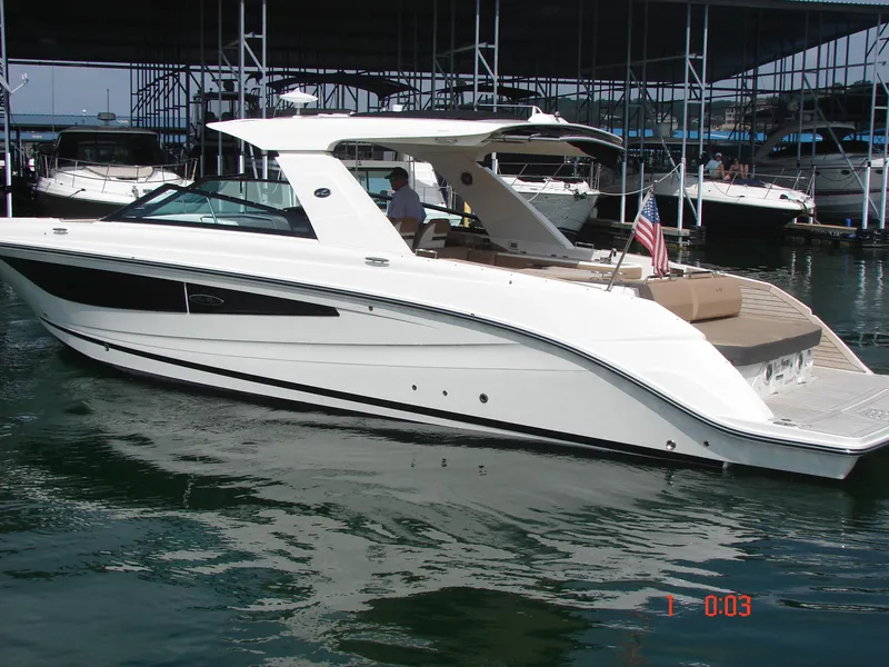 Slide: The Image of 2018 Sea Ray SLX 400 boat docked in marina, side view. - 34