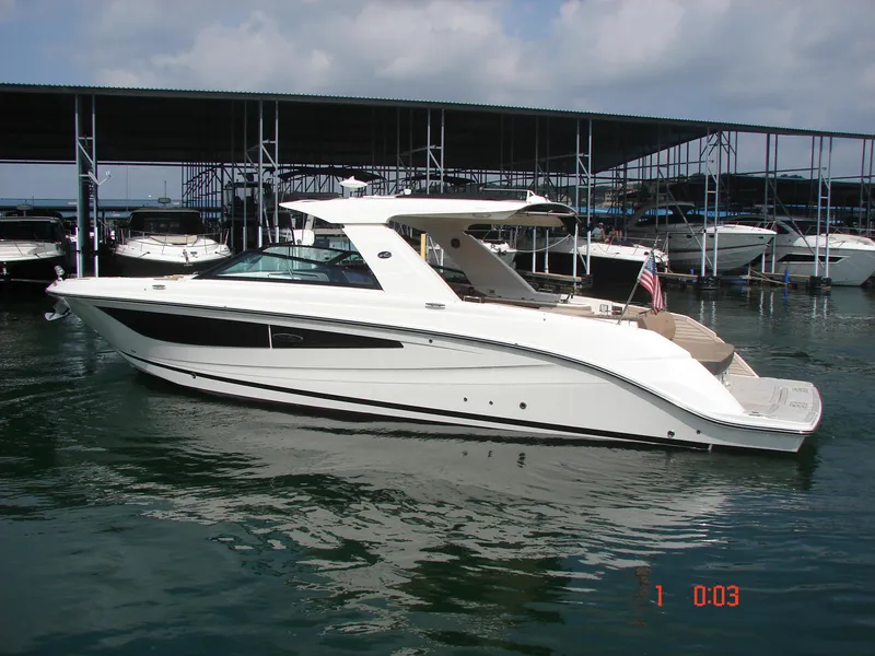 Slide: The Image of 2018 Sea Ray SLX 400 yacht docked in marina, side view. - 35