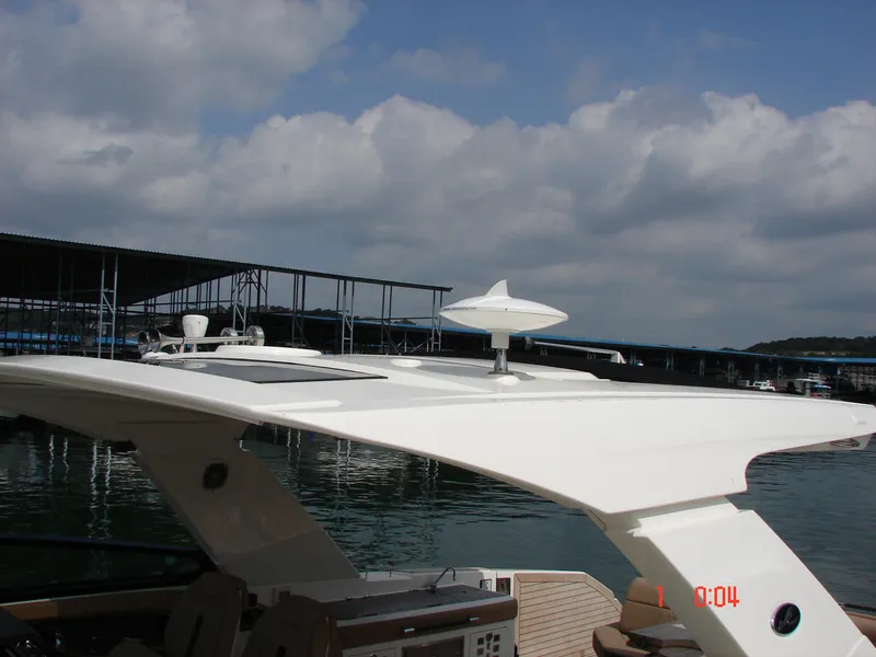 Slide: The Image of 2018 Sea Ray SLX 400 boat docked under cloudy sky. - 38