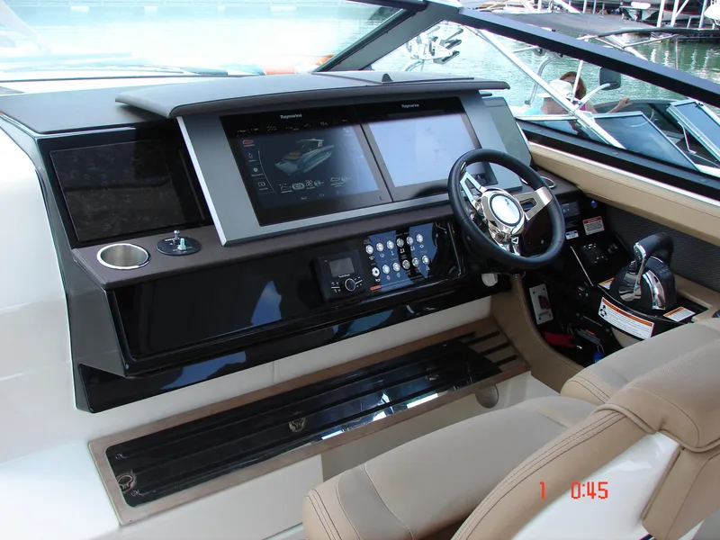 Slide: The Image of 2018 Sea Ray SLX 400 helm with modern controls and navigation screens. - 40
