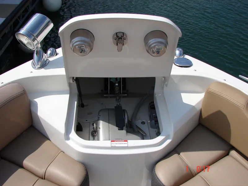 Slide: The Image of 2018 Sea Ray SLX 400 boat seating area with storage compartment open. - 48