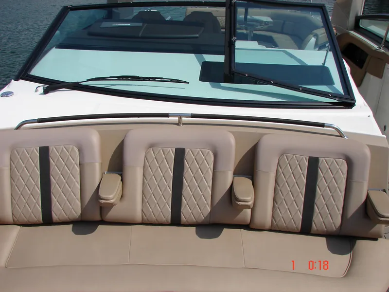 Slide: The Image of 2018 Sea Ray SLX 400 boat with beige quilted seating and windshield. - 49
