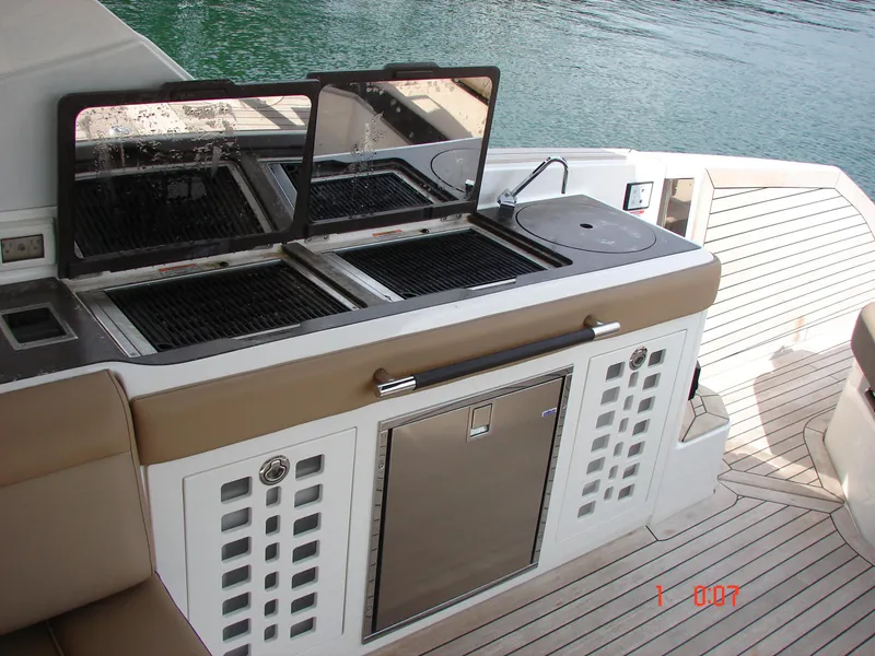 Slide: The Image of 2018 Sea Ray SLX 400 yacht outdoor kitchen with grill and sink. - 8