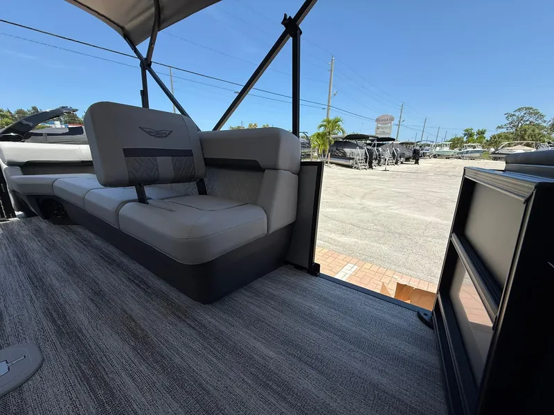 Slide: The Image of 2026 Bennington 26 MFB boat interior with plush seating and modern design. - 10