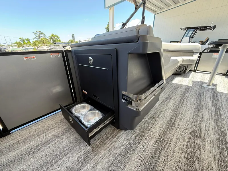 Slide: The Image of 2026 Bennington 26 MFB boat interior with storage and built-in pet bowls. - 17