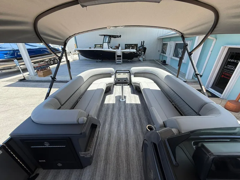 Slide: The Image of Bennington 26 MFB 2026 pontoon boat interior with spacious seating and canopy. - 20