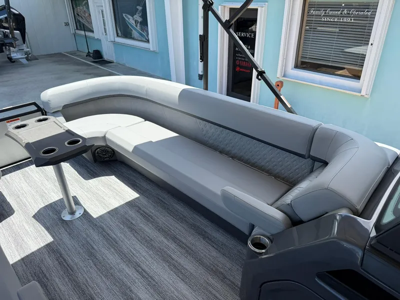 Slide: The Image of 2026 Bennington 26 MFB boat interior with sleek gray seating and modern design. - 22