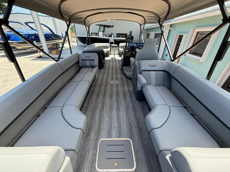 Slide: The Image of 2026 Bennington 26 MFB pontoon boat interior with spacious seating and canopy. - 5