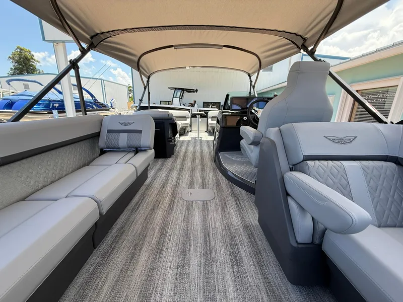 Slide: The Image of 2026 Bennington 26 MFB pontoon boat interior with luxurious seating and canopy. - 6