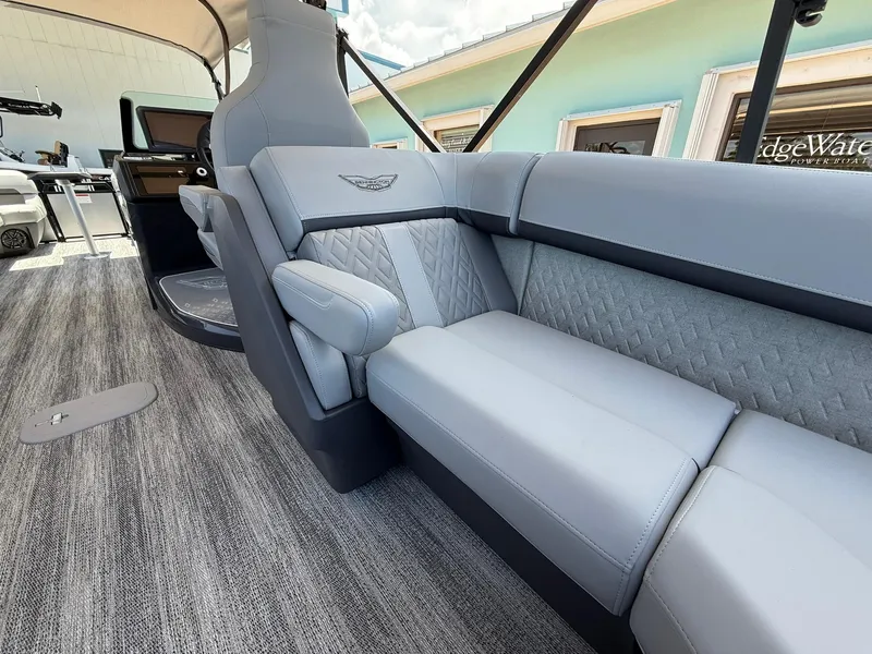 Slide: The Image of 2026 Bennington 26 MFB boat interior with luxurious gray seating and modern design. - 7