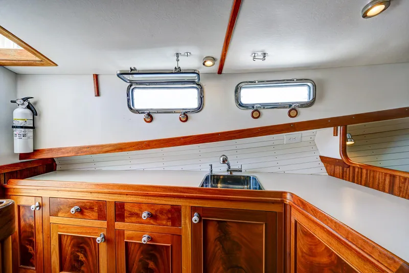 Slide: The Image of Luxurious wooden yacht interior with sink, cabinets, and portholes, Holland Open 2008 model. - 19