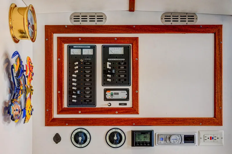 Slide: The Image of Electrical control panel on a 2008 Holland Open boat with gauges and switches. - 26