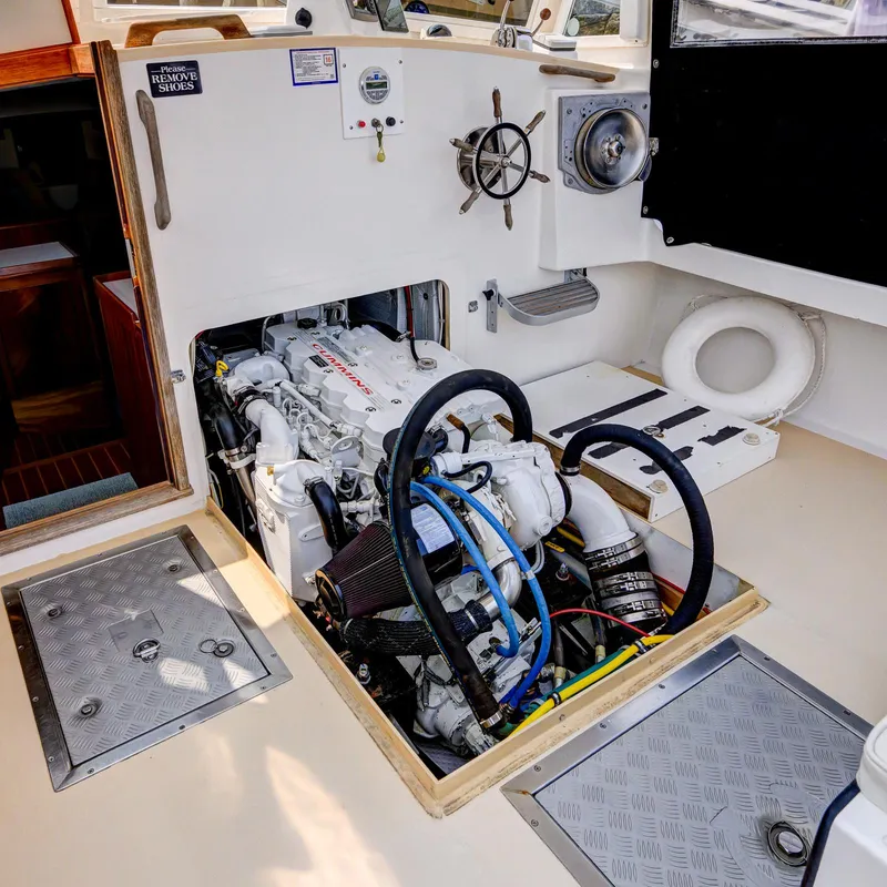 Slide: The Image of Engine compartment of a 2008 Holland Open boat, showcasing detailed mechanical components. - 30
