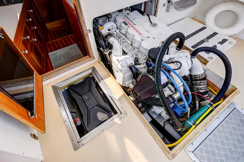 Slide: The Image of Engine compartment of a 2008 Holland Open boat, showcasing detailed mechanical components. - 31