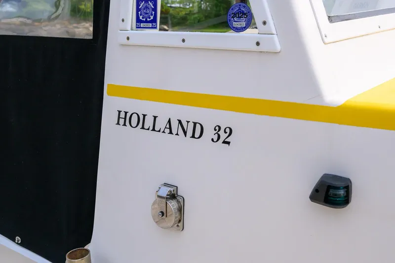 Slide: The Image of Holland 32 boat exterior with lock and window, 2008 model. - 35