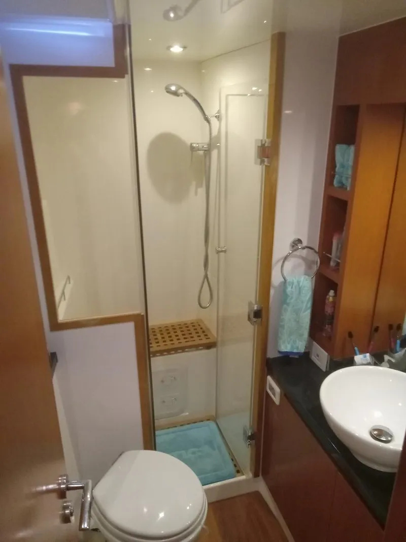 Slide: The Image of Modern bathroom in 2016 Aquila 44 yacht with shower, sink, and toilet. - 26