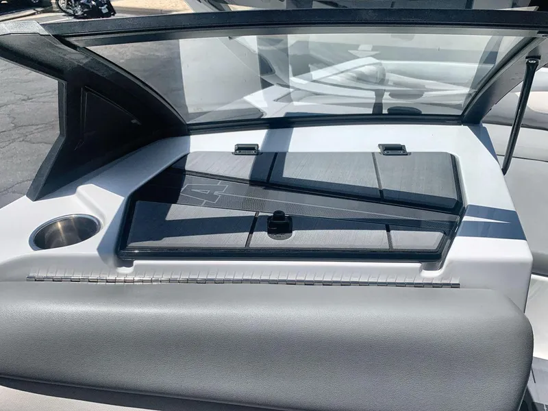 Slide: The Image of 2022 Axis A20 boat dashboard with windshield and storage compartment. - 18