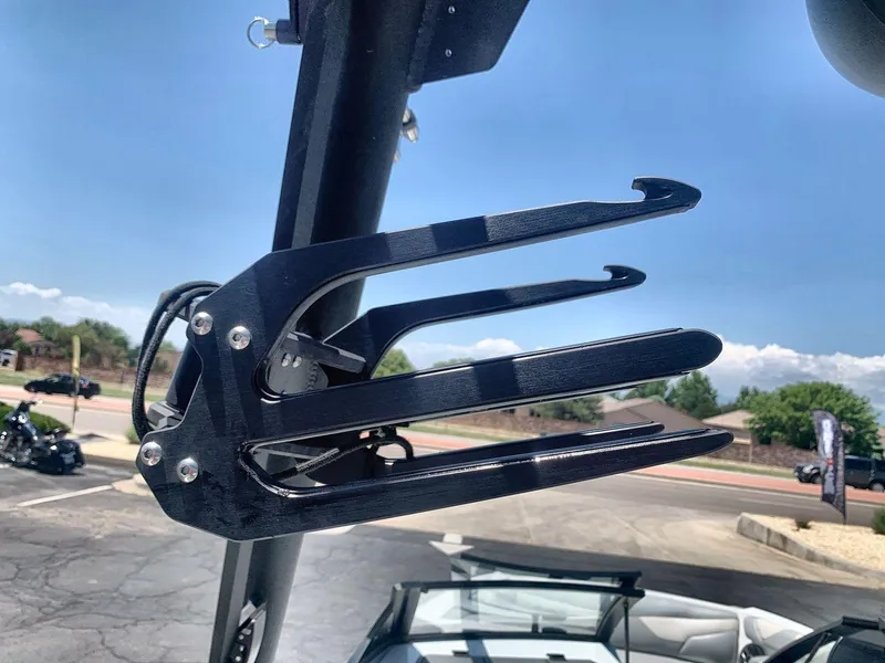 Slide: The Image of 2022 Axis A20 boat wakeboard rack under clear blue sky. - 22