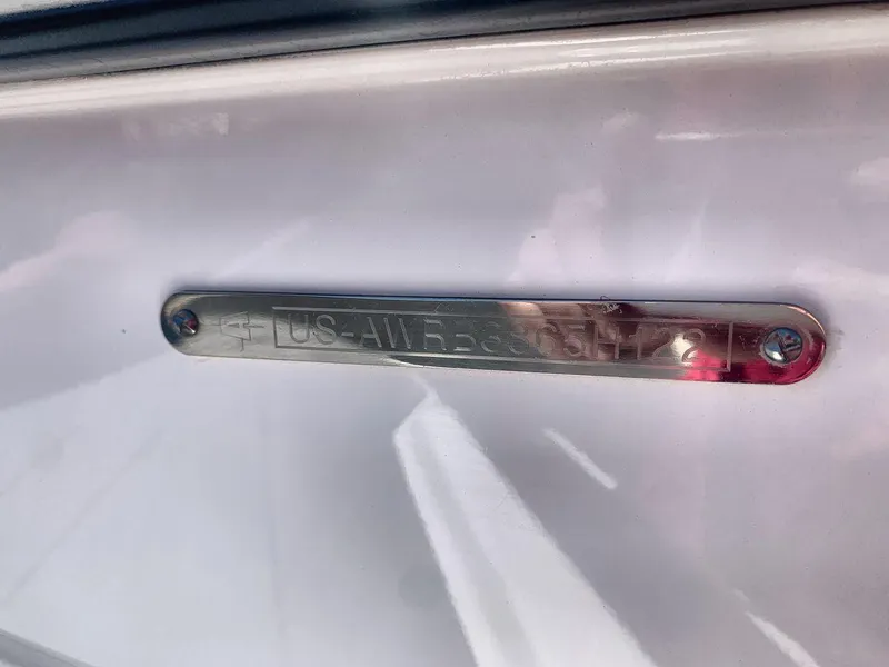 Slide: The Image of 2022 Axis A20 boat identification plate on white surface. - 25