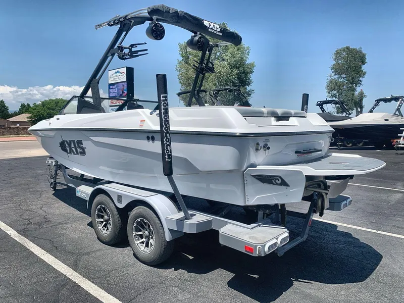 Slide: The Image of 2022 Axis A20 boat on trailer, parked outdoors, showcasing sleek design and modern features. - 3
