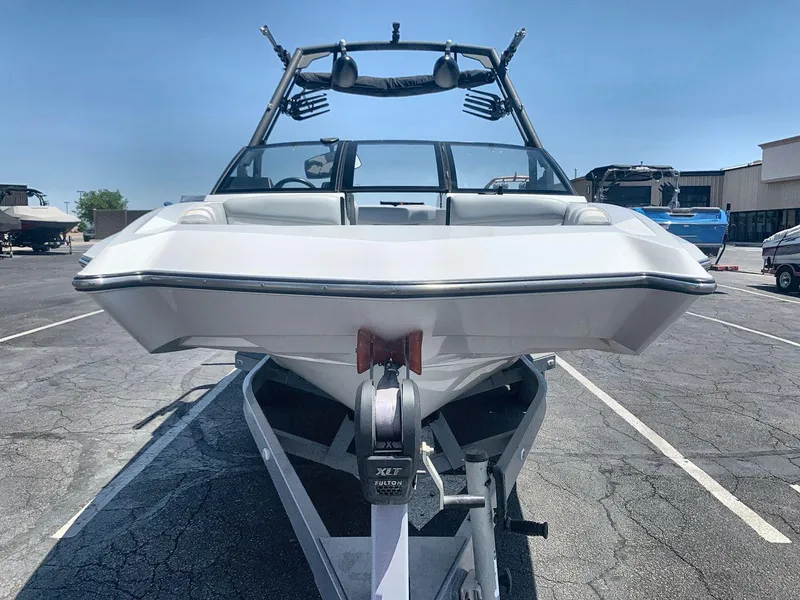 Slide: The Image of 2022 Axis A20 boat on trailer in parking lot, front view. - 8