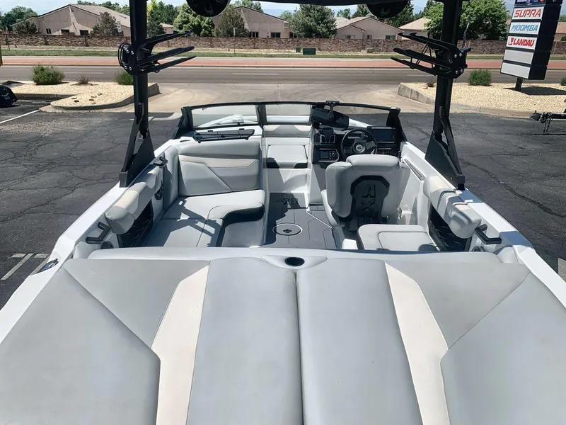 Slide: The Image of 2022 Axis A20 boat interior with sleek seating and modern dashboard. - 9