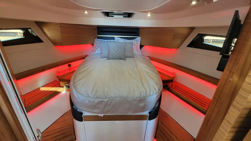Slide: The Image of Luxurious cabin interior of 2021 Boston Whaler 405 Conquest with ambient red lighting. - 14