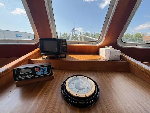 Slide: The Image of Pilothouse of 1989 Maritime 340 Trawler with navigation instruments and large windows. - 10