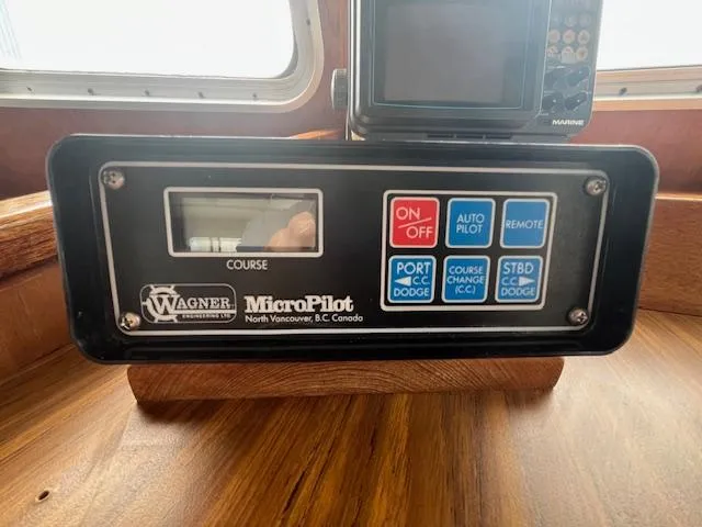Slide: The Image of Wagner MicroPilot control panel on 1989 Maritime 340 Trawler, featuring autopilot and navigation buttons. - 12
