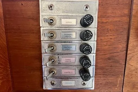 Slide: The Image of Control panel of a 1989 Maritime 340 Trawler with labeled switches and dials. - 15