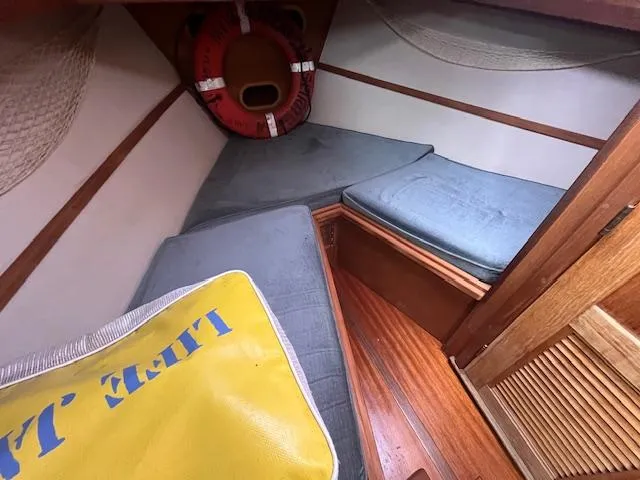 Slide: The Image of Cozy cabin interior of 1989 Maritime 340 Trawler with cushions and life preserver. - 19