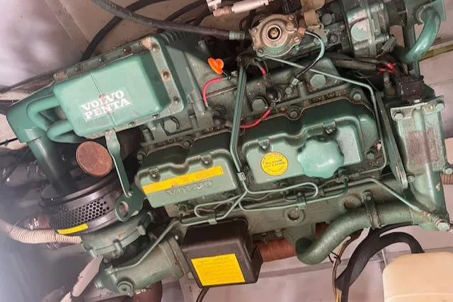 Slide: The Image of Engine of a 1989 Maritime 340 Trawler, featuring a Volvo Penta motor. - 36